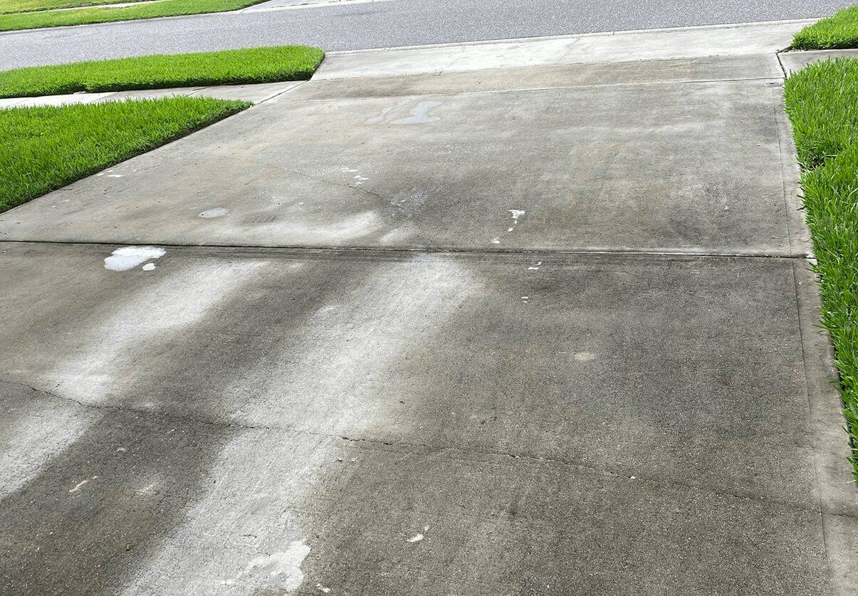 Concrete before pressure washing
