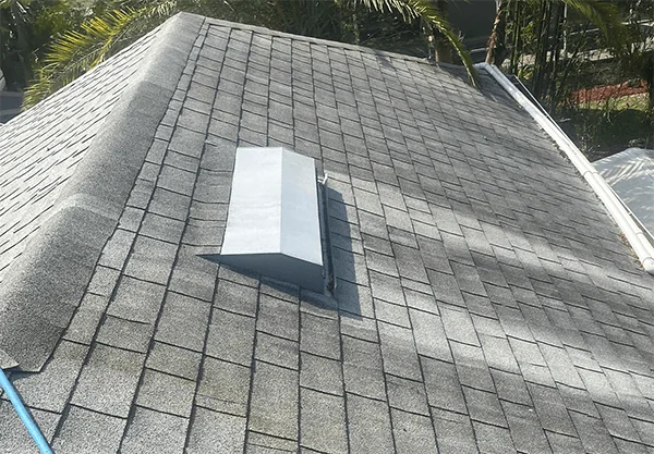 Roof with organic staining before soft washing